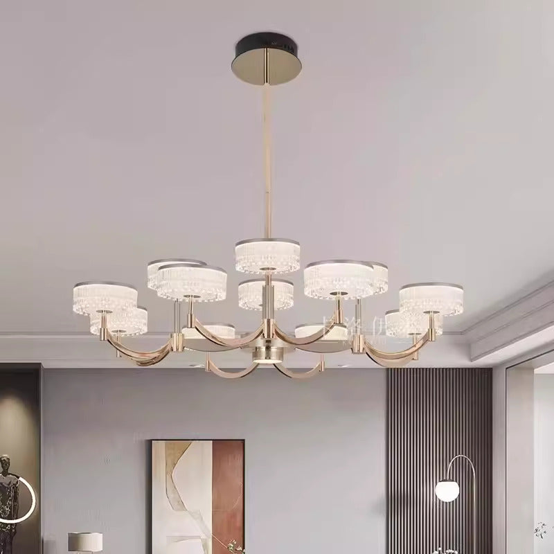 Modern chandelier hanging in a room with neutral walls and decor.