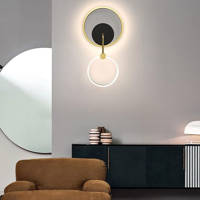 Modern wall sconce with a round design in a minimalistic interior setting.
