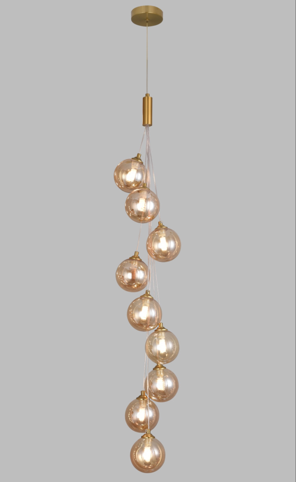 Decorative pendant light with multiple bulbs on a gray background