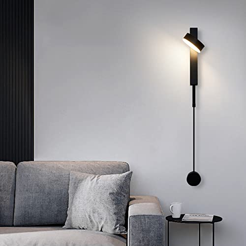 Modern wall lamp in a living room setting with a sofa and side table.