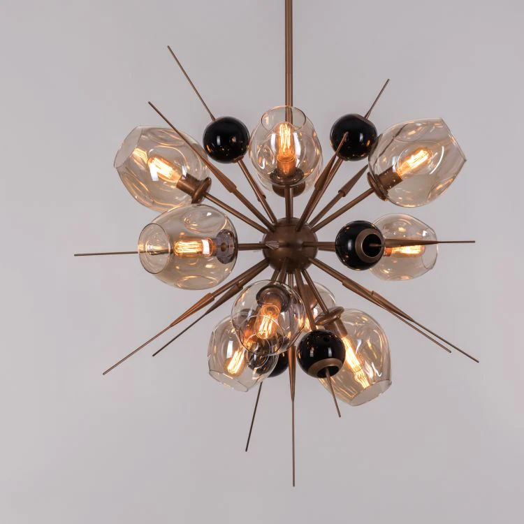 Modern chandelier with multiple light bulbs on a plain background