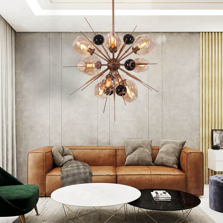 Modern living room with a brown leather sofa, round coffee table, and decorative chandelier.