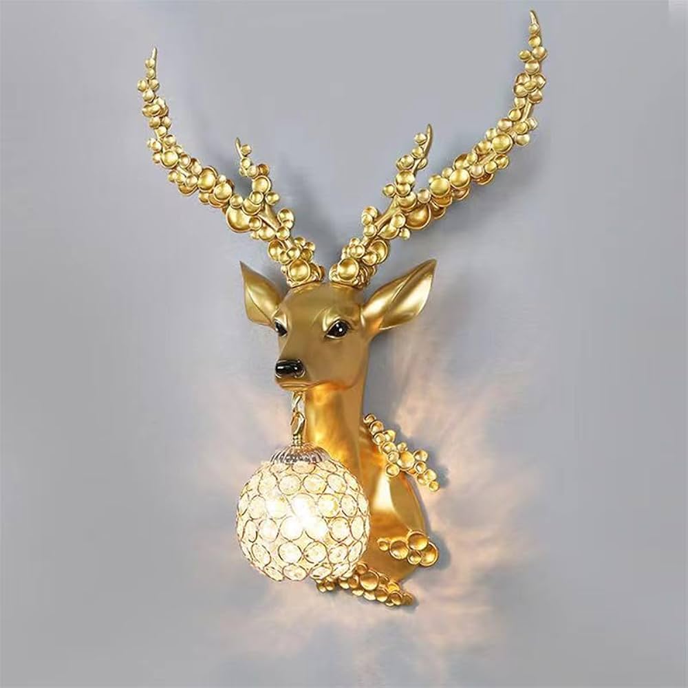 Gold deer-shaped wall light fixture on a gray background
