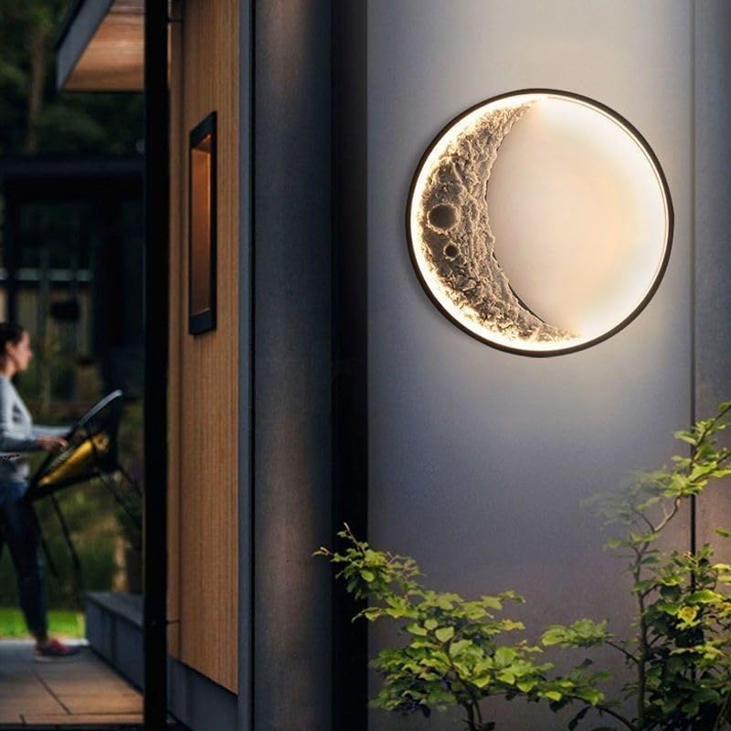 Round wall light fixture on a house exterior with a person and garden in the background