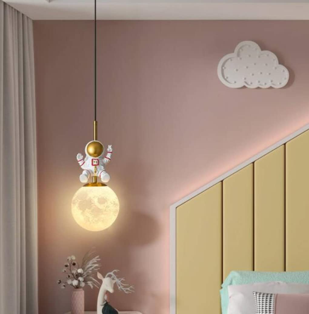 Pendant light with astronaut design in a room with pink wall and cloud decoration