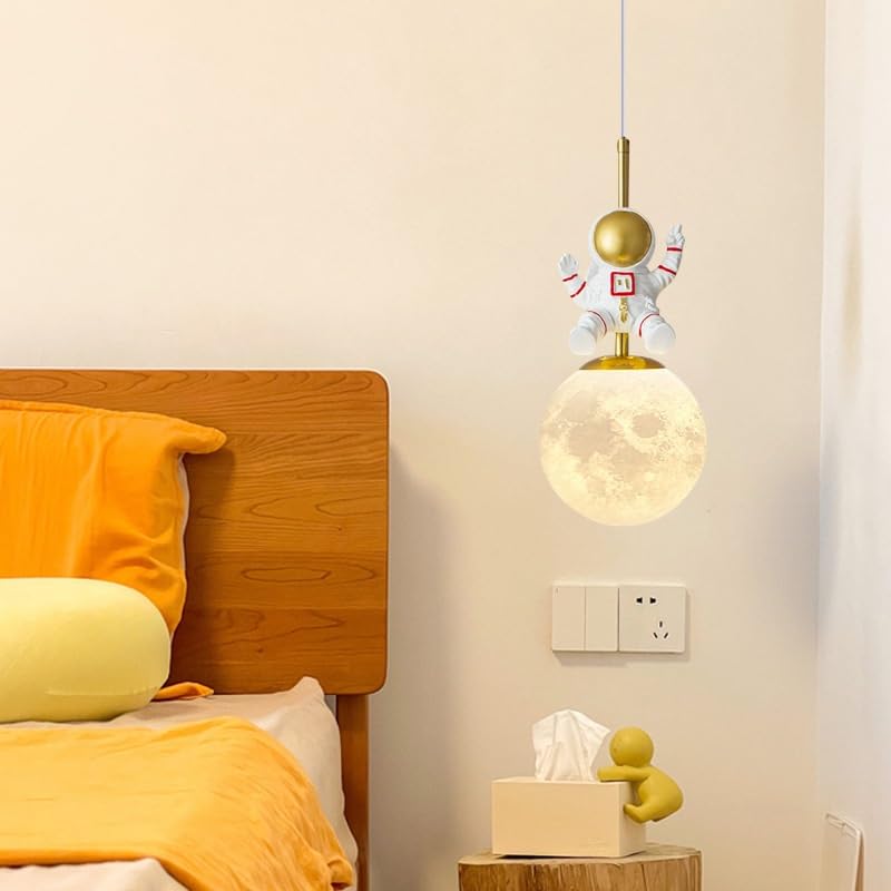 Pendant light fixture with decorative elements above a bed in a bedroom setting.