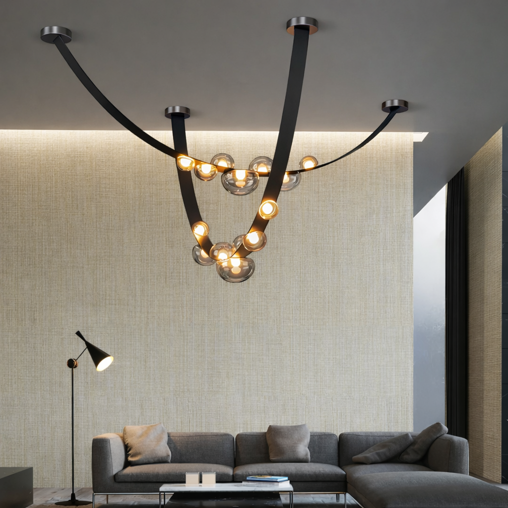 Modern chandelier hanging above a living room with a gray sofa and floor lamp.