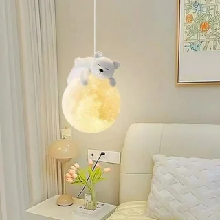 Lamp with a teddy bear design on a nightstand in a bedroom setting