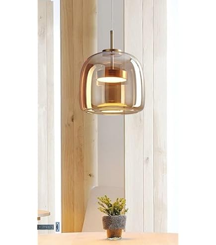 Modern pendant light with glass shade in a minimalistic room setting