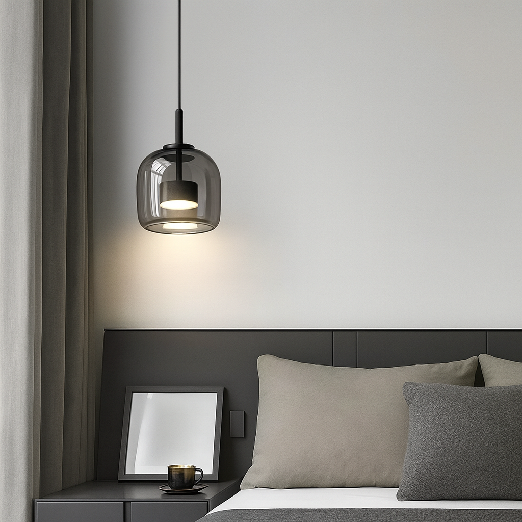 Modern bedroom with a pendant light, bed, and side table.