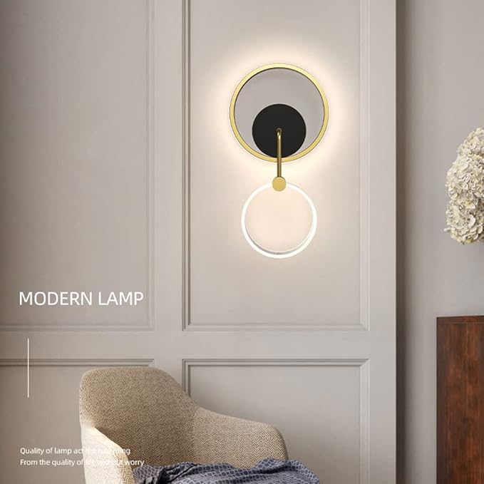 Modern wall lamp on a gray wall with a chair and decorative item in the foreground.