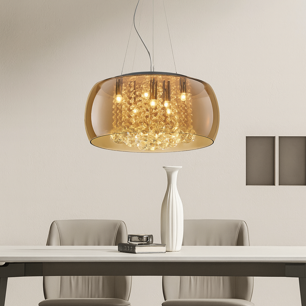 Modern dining room with a pendant light, table, chairs, and a vase.