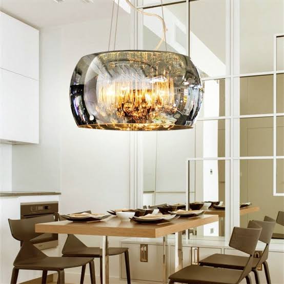 Modern dining room with a stylish pendant light fixture.