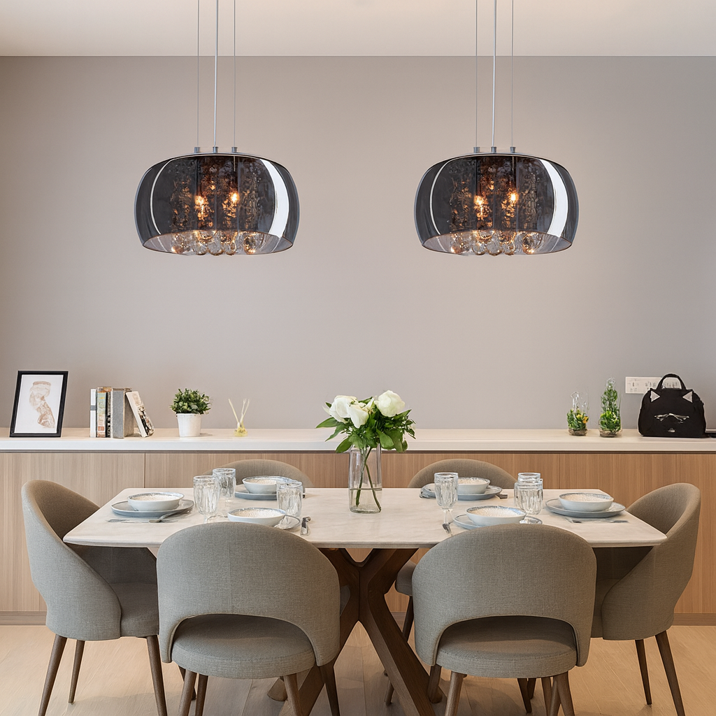 Modern dining room with pendant lights, table, and chairs.