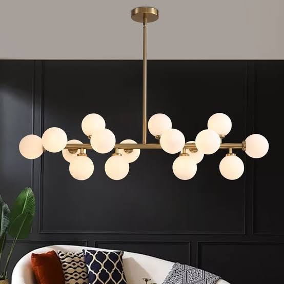 Modern chandelier with multiple round lights in a living room setting.