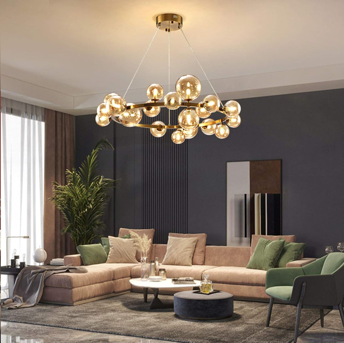 Modern living room with a gold chandelier, beige sectional sofa, and decorative items.