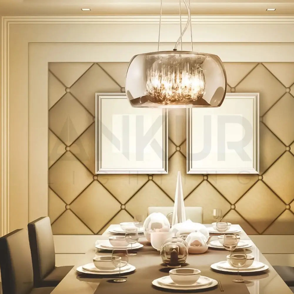 Dining room with a table set for a meal, modern pendant light, and decorative wall art.