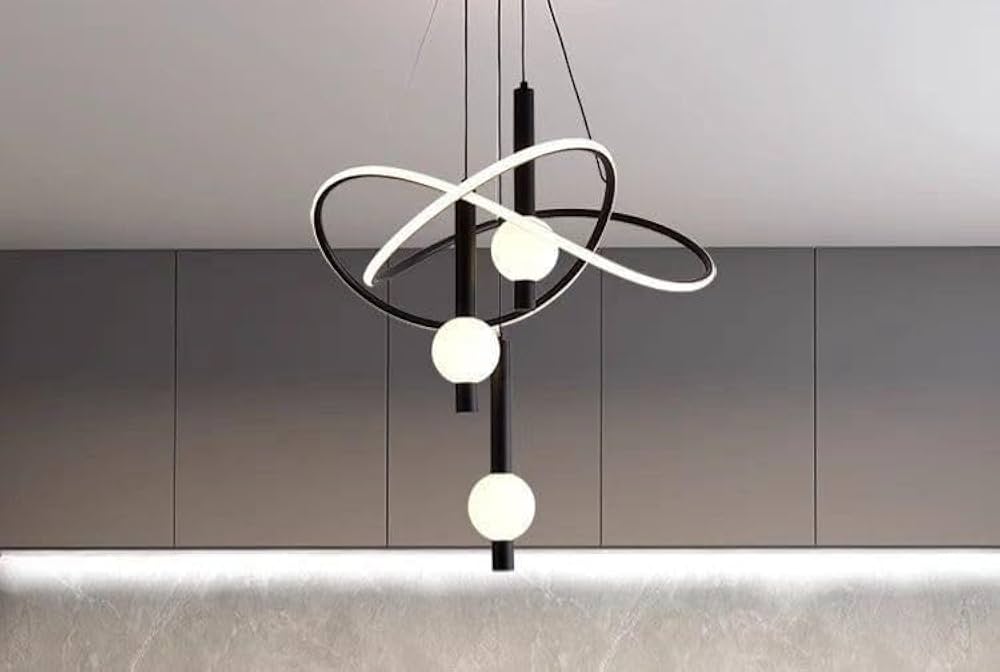 Modern pendant light fixture with three spherical bulbs against a neutral background