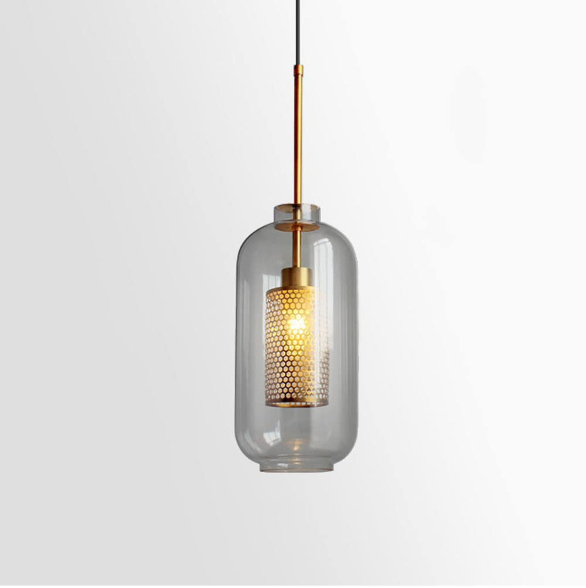 Modern pendant light with clear glass shade and gold accents on a white background
