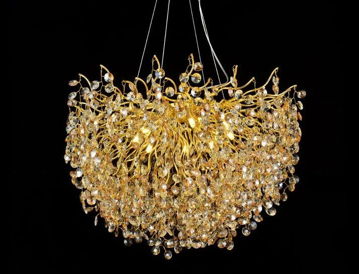 Gold chandelier with crystal accents on a black background