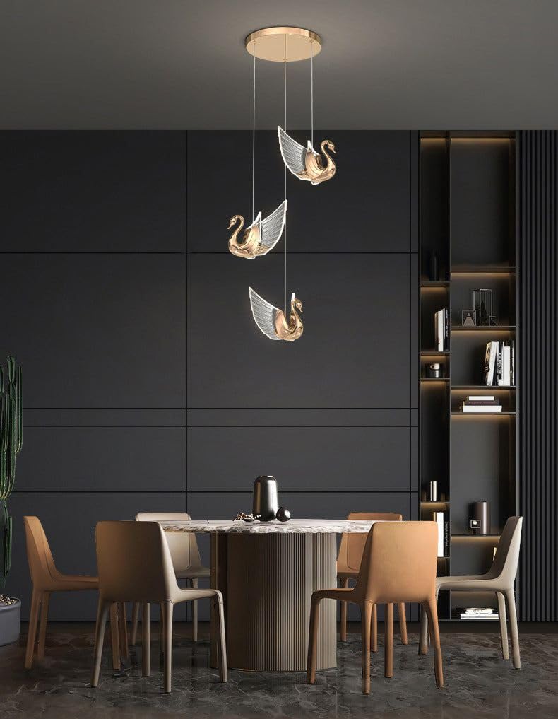 Dining room with a modern pendant light featuring swan designs.