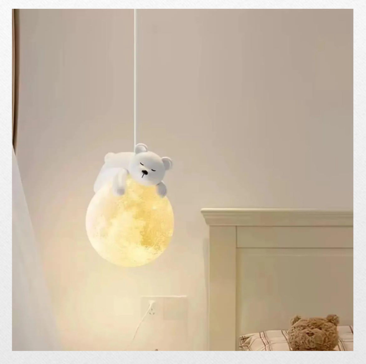 Ceiling light fixture with a bear-shaped lampshade in a room setting.
