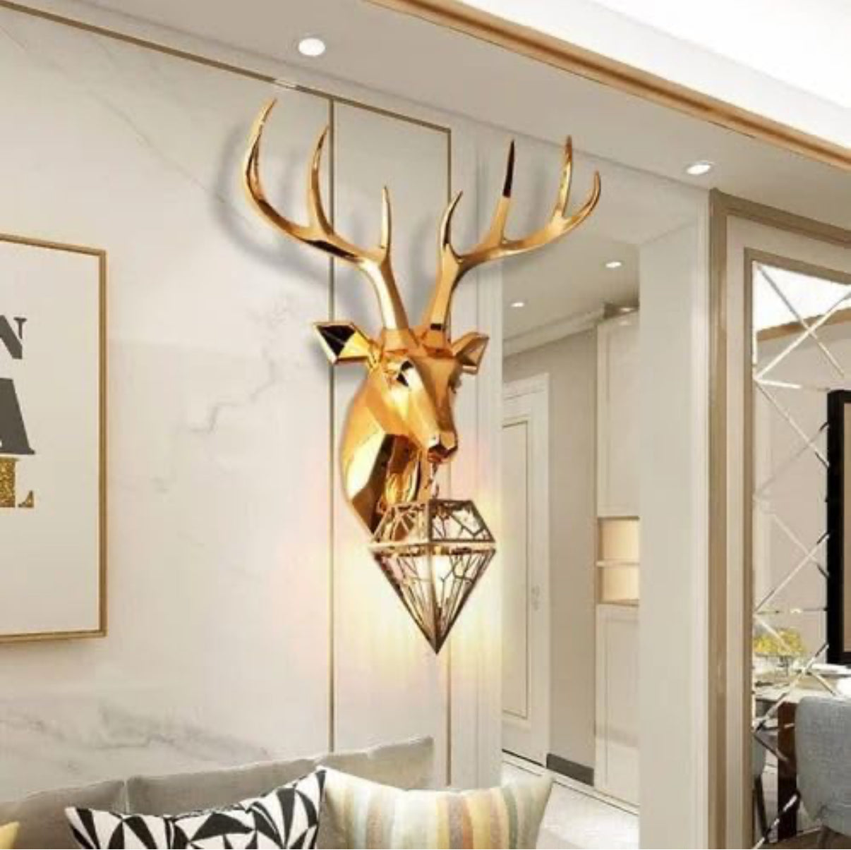 Gold deer head wall decoration in a modern interior setting