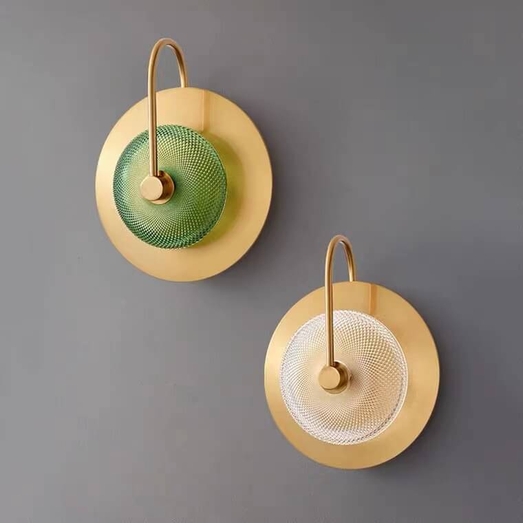 Two wall-mounted decorative lights with gold frames and mesh designs on a gray background.