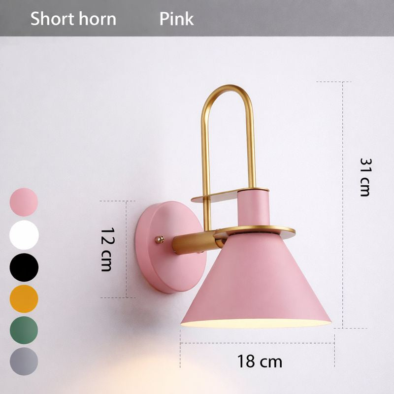 Pink wall lamp with gold accents and dimensions on a white background