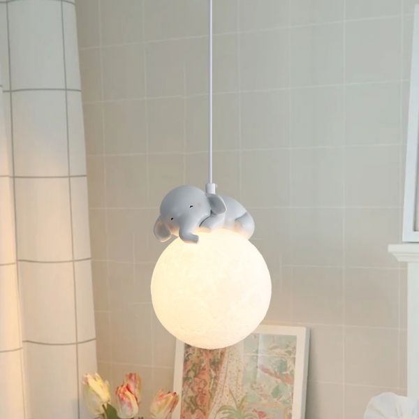 Children's pendant light with elephant design on a neutral background