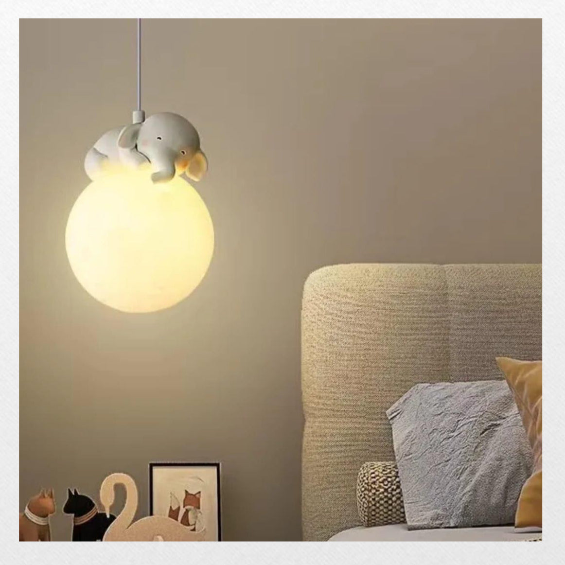 Light fixture hanging above a bed in a bedroom setting