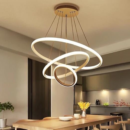 Modern pendant light fixture hanging above a dining table in a kitchen.