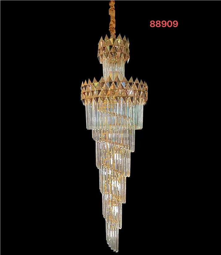 A gold-colored crystal chandelier with a diamond-shaped pattern and a central LED light source, hangable from a chain.