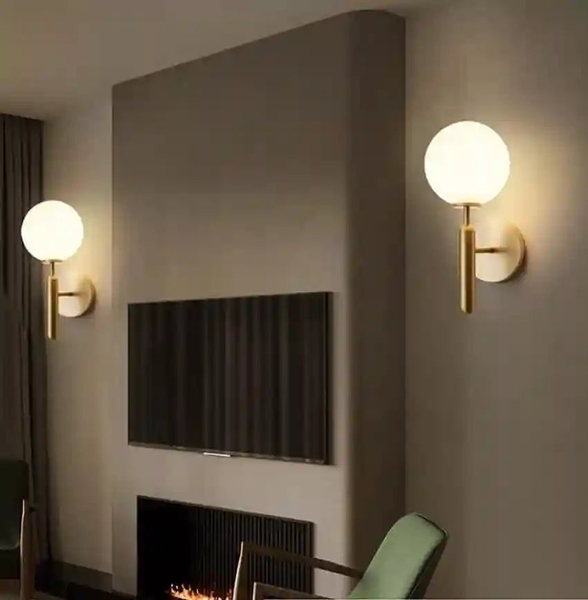 Modern interior design with wall-mounted lights and a television.