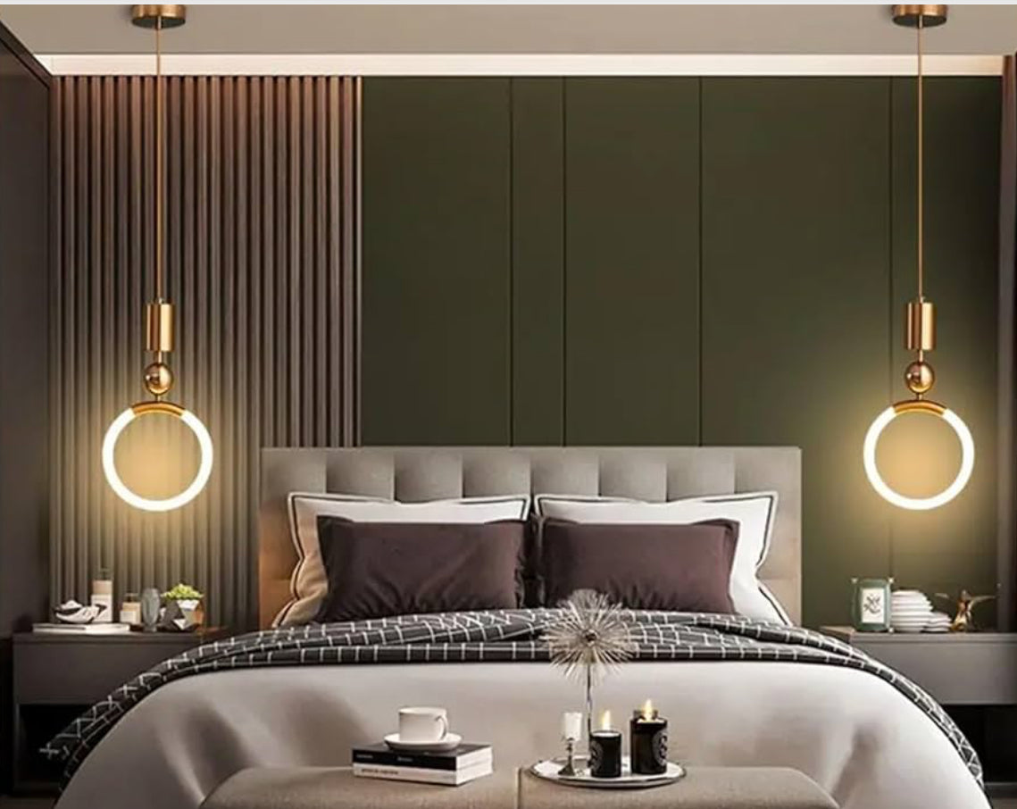 Modern bedroom with a bed, nightstands, and pendant lights.