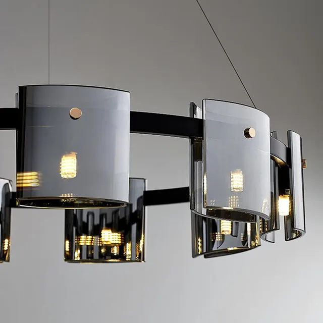 Modern chandelier with glass shades on a gray background