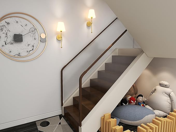 Staircase with a round clock on the wall and plush toys on a staircase landing.