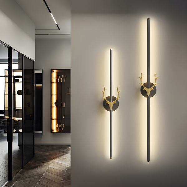 Modern wall lights with deer head design on a wall in a stylish interior setting.