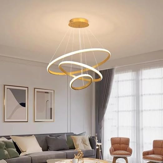 Modern living room with a gold circular pendant light fixture.