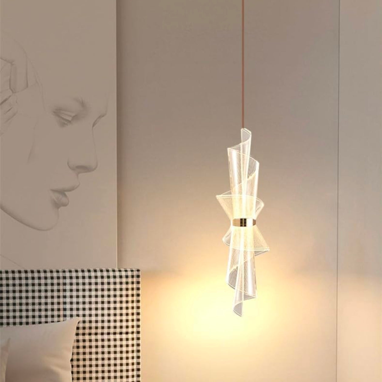 Modern pendant light hanging in a room with decorative wall and checkered fabric.