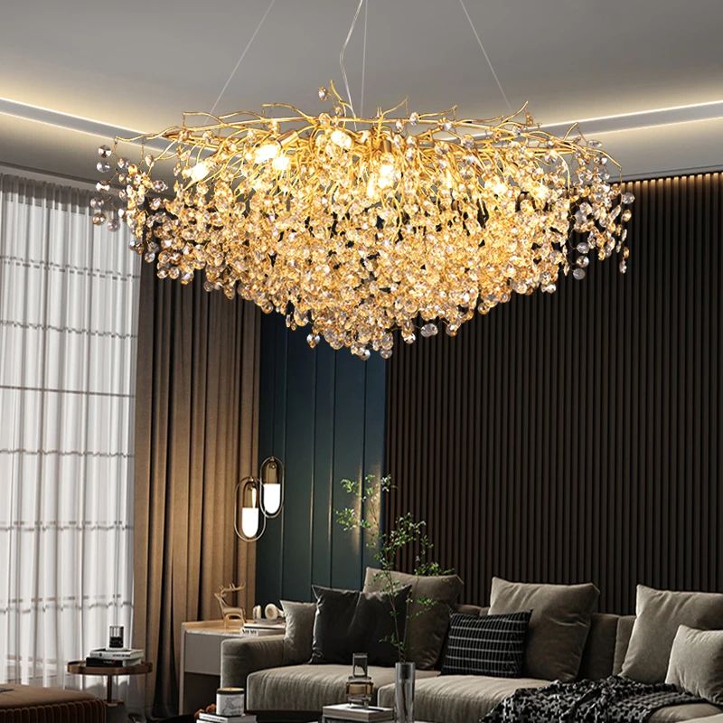 Luxurious chandelier hanging in a living room with a sofa and decor.