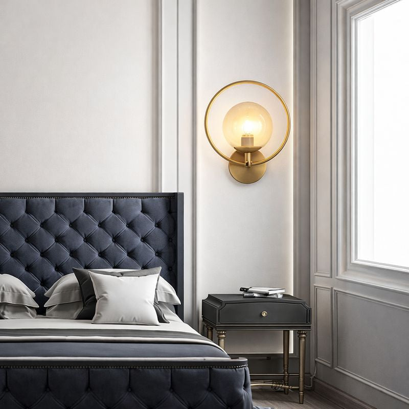 Modern bedroom with tufted headboard, nightstand, and wall sconce.