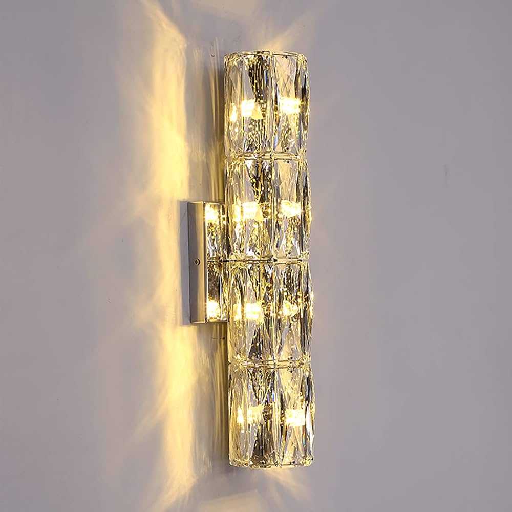 Crystal wall sconce light fixture on a gray wall