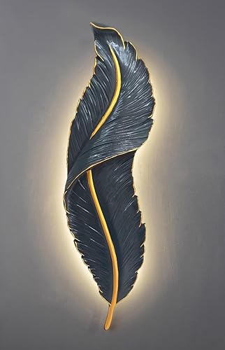 Decorative wall sconce shaped like a leaf on a gray background