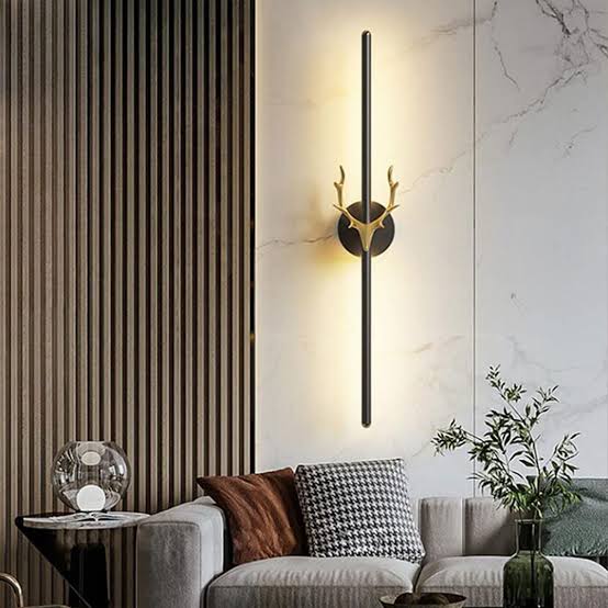 Modern wall lamp with deer antlers in a living room setting