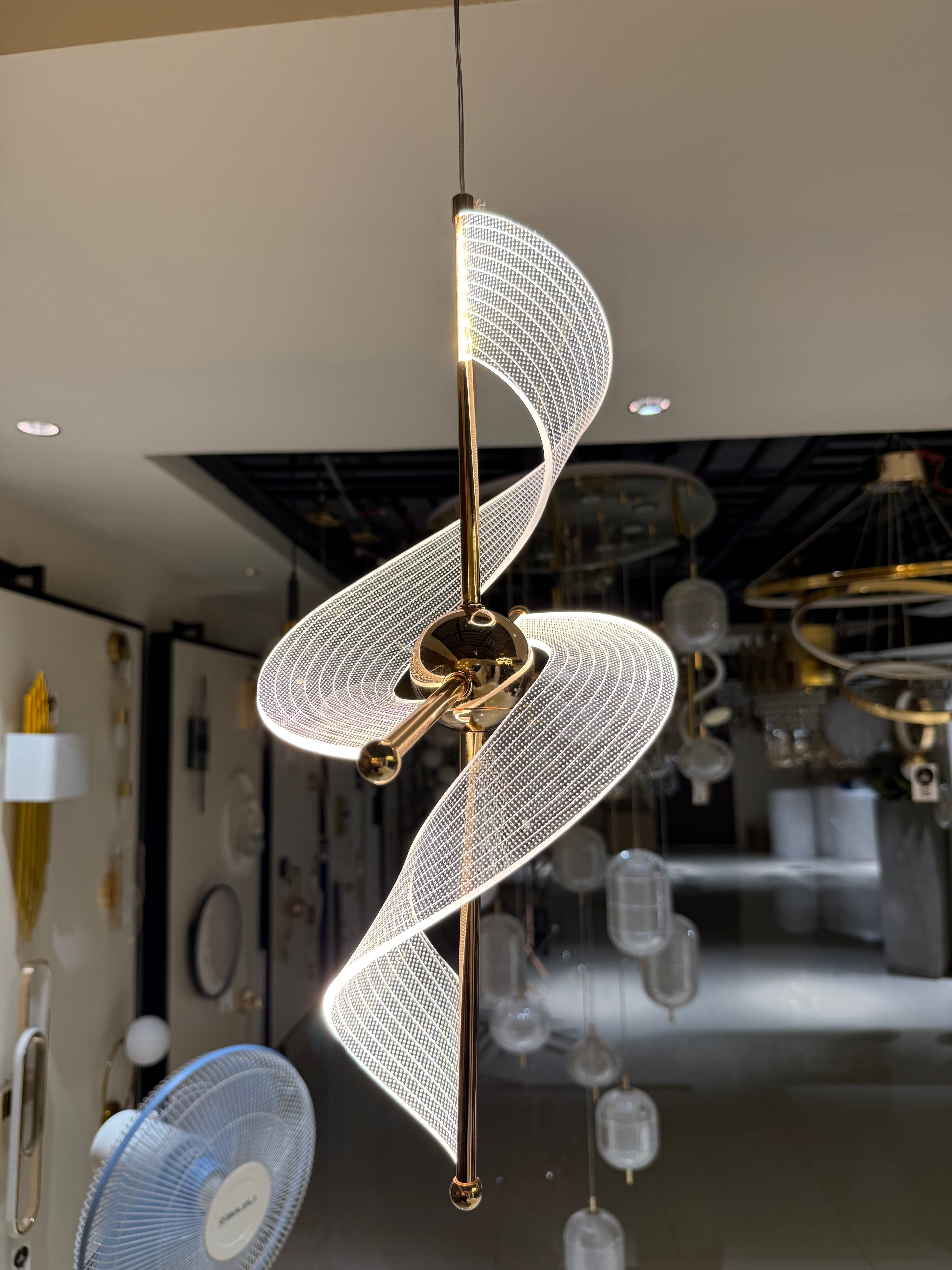 Modern pendant light with wavy design in a kitchen setting