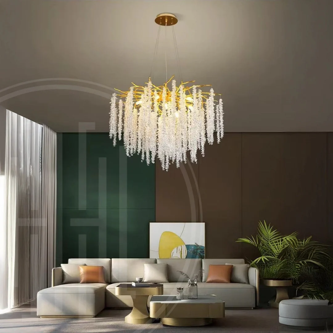 Modern living room with a chandelier, sofa, and decorative elements.
