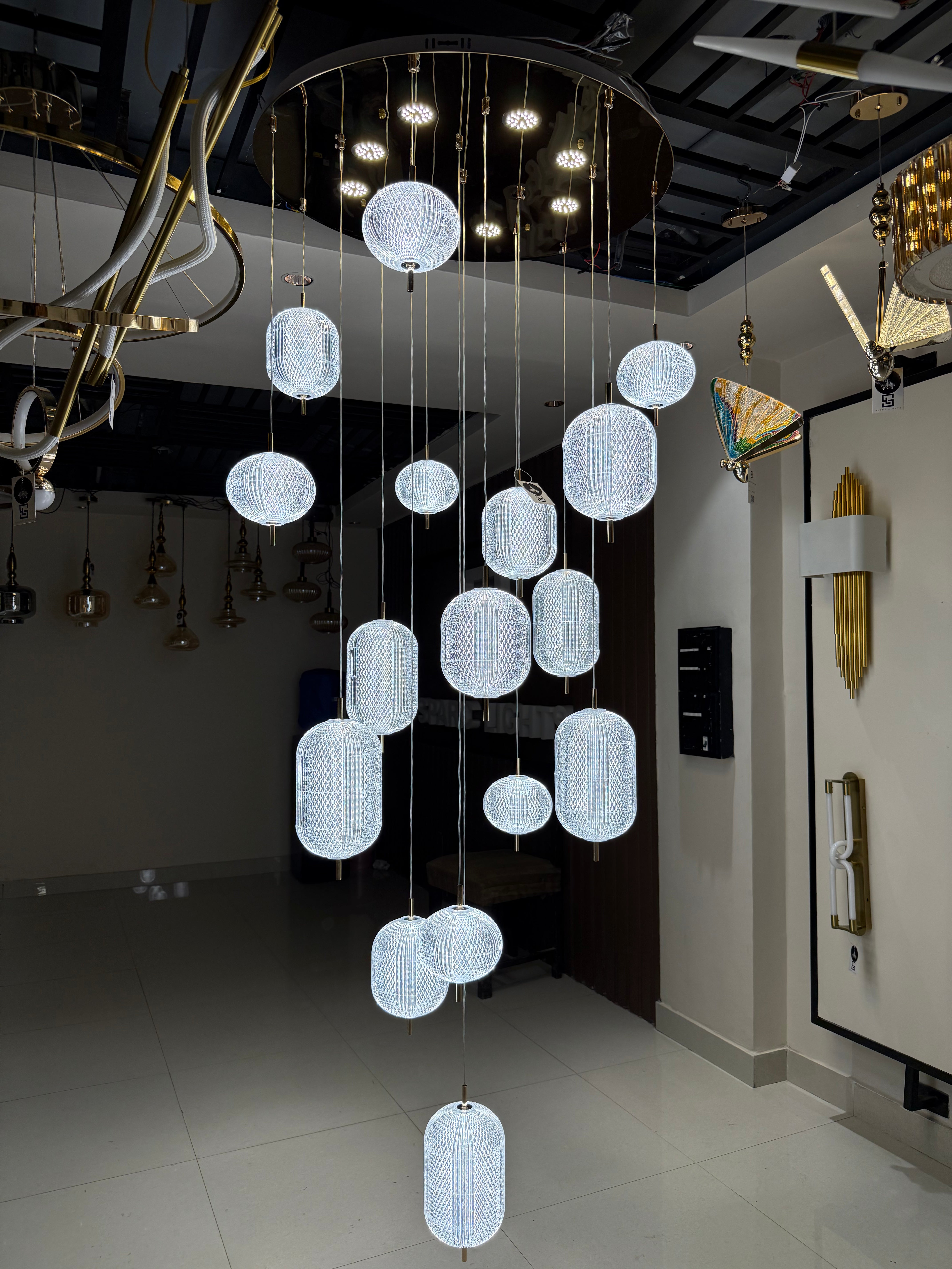 Modern chandelier with hanging lights in a showroom setting