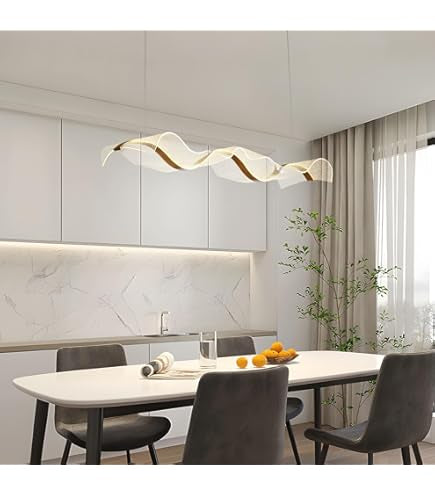 Modern dining room with a wavy ceiling light fixture, white table, and gray chairs.
