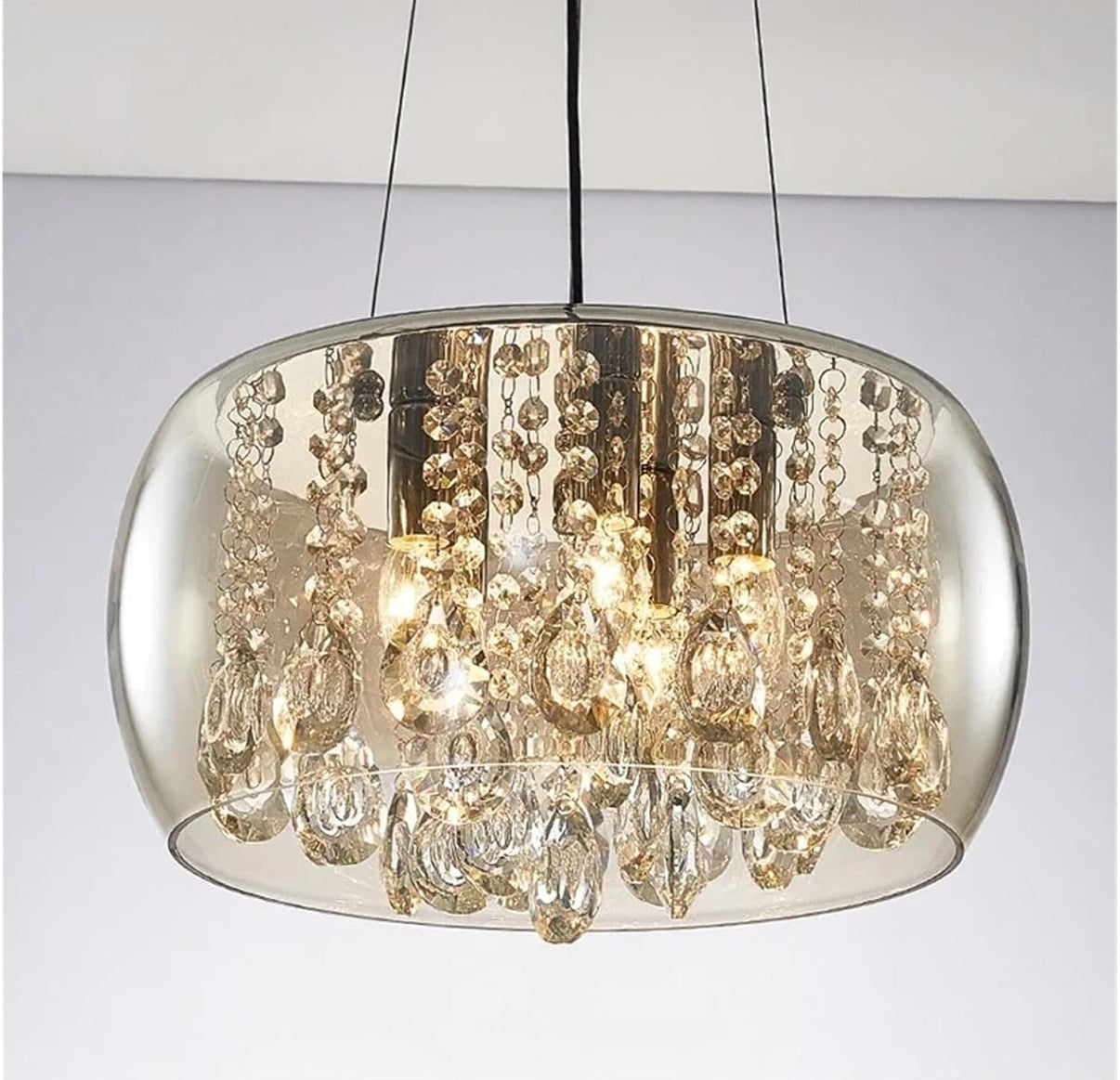 Crystal chandelier with a metallic frame on a plain background